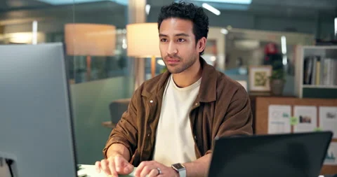 Computer, design and typing with man in office at night for online research or Stock Footage 322574238