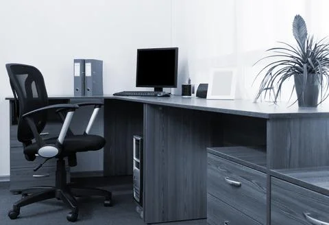 Computer on a desk at modern office Stock Photos