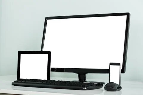 Computer Desktop With Digital Tablet And Mobilephone On Desk Foto stock