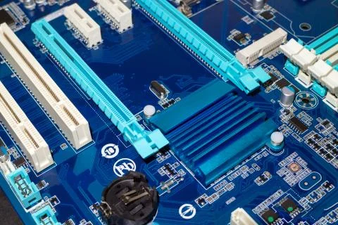 A computer desktop mainboard with electronic components closeup Stock Photos
