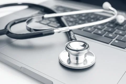 Computer diagnose concept. Stethoscope on modern laptop computer 스톡 사진