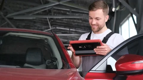 Computer diagnostics of the correct operation of the electric vehicle. Car Stock Footage 229957920