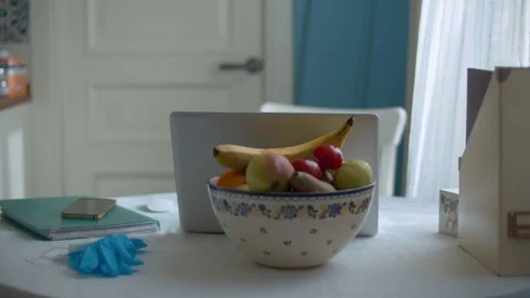 Computer on dining table in kitchen Stock Footage 126816105