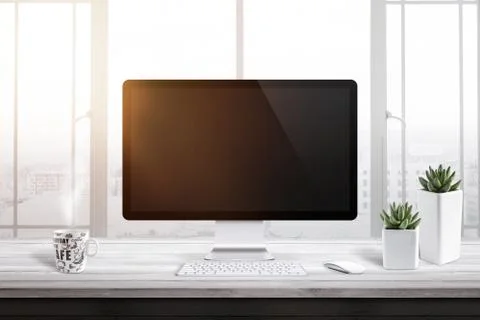 Computer display with blank screen for mockup in office or work room. Window  Stock Photos