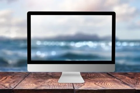 Computer display with blurred sea background. 写真素材