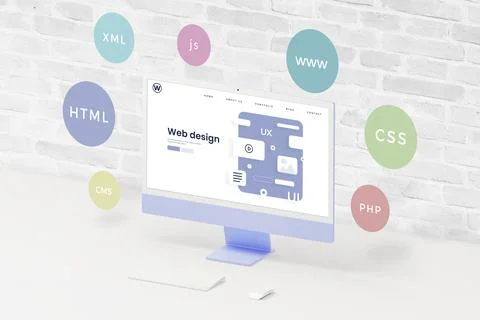 Computer display on desk with UI, UX web page layout. Surrounding balloons Stock-Fotos