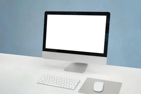 Computer display mockup. Clean office desk with computer display, mouse and k Stock Photos