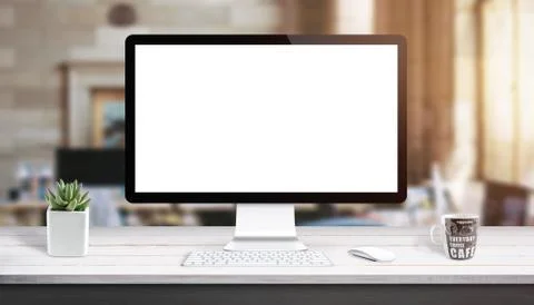Computer display mockup. Modern studio work desk with plant, keyboard, mouse  Stock Photos
