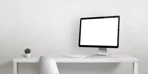Computer display mockup on work desk with copy space beside on white wall. Is Stock Photos