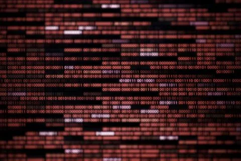 Computer display screen with red binary code moving in the background. blur d Stock Photos
