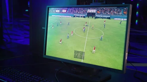Computer Display Shows Player Controlling Football Athletes In PC Game Stock Footage 250714957