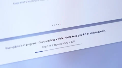Computer display shows system update Your update is in progress with Downlo.. Stock Footage 314389056