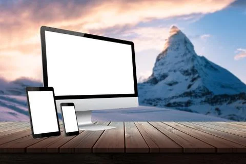 Computer display, tablet and smart phone responsive display devices on table Stock Photos