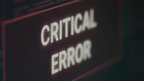 Computer displaying critical error message flashing on screen after cyber crime Stock Photos
