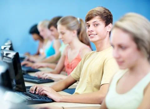Computer, education and portrait with boy in classroom for learning, lectur.. 库存照片