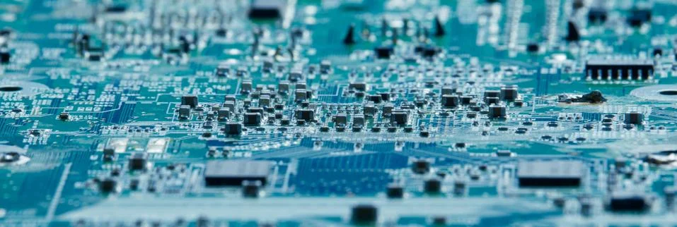 Computer elements on the circuit board with a low depth of field. Stock Photos