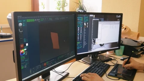 Computer engineer creates technological detail on computer Stock Footage 121224714