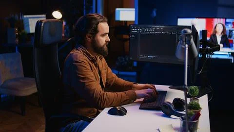 Computer engineer deliberating ways of fixing errors while developing code Stock-Fotos