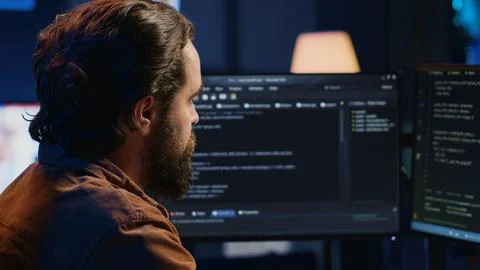 Computer engineer deliberating ways of fixing errors while developing code 스톡 사진