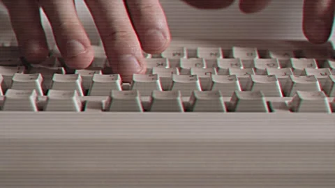 Computer engineer developer is working on old vintage computer 1990s. Antique Stock Footage 249338462