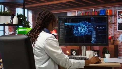 Computer engineer doing checkup on artificial intelligence systems Stock Photos