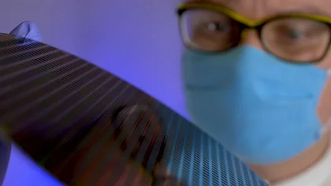 Computer engineer holds silicon wafe Video stock 150454947