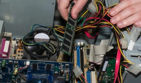 Computer engineer installs a working unit Stock-Fotos