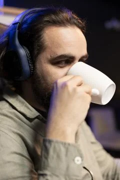 Computer engineer listening music while updating AI neural networks Foto stock