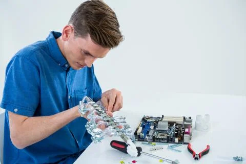 Computer engineer repairing computer motherboard Stock Photos