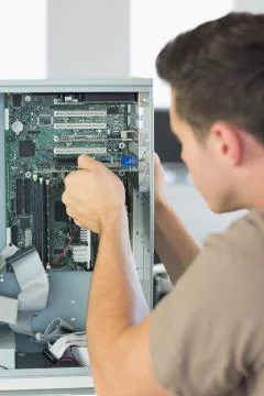Computer engineer repairing computer Stock Photos