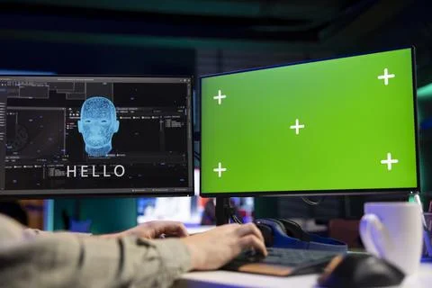 Computer engineer seeing artificial intelligence talking on chroma key monitor Stock Photos