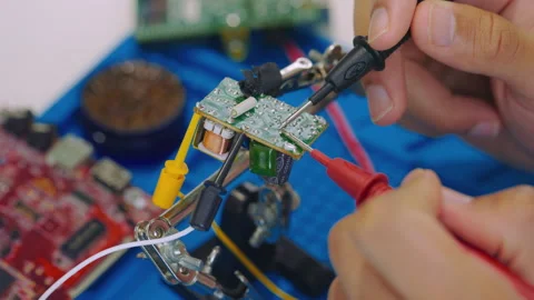 Computer Engineer with Tester Inspects Motherboard. Close Up Stock Footage 246866101