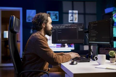 Computer engineer typing on keyboard, writing code to build firewalls Stock Photos
