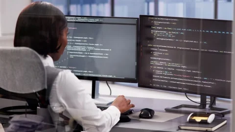 Computer engineer using code to develop web software Stock Footage 260591429