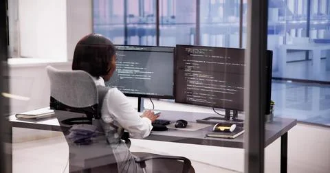 Computer engineer using code to develop web software Stock-Fotos