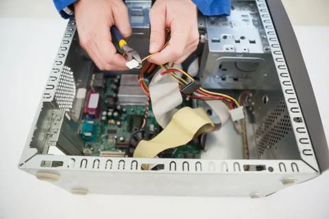 Computer engineer working on broken cable Stock Photos