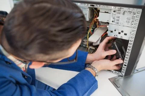 Computer engineer working on broken console Stock Photos