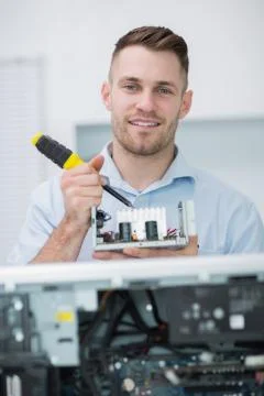 Computer engineer working on cpu part in front of open cpu Foto stock