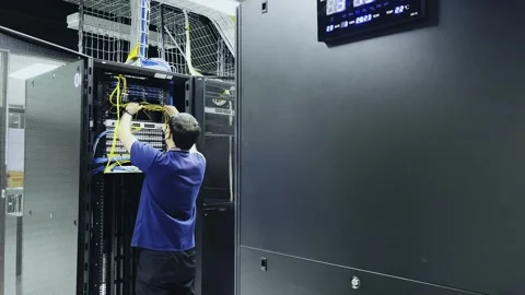 Computer engineer working with supercomputer in data center. Stock Footage 245570287