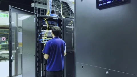 Computer engineer working with supercomputer in data center. Stock Footage 260634533