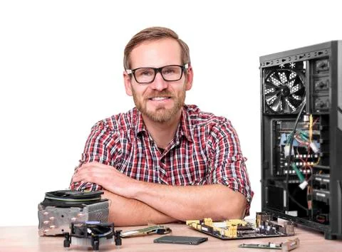 Computer engineer at workplace. Stock Photos