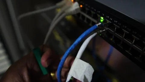 Computer engineers are repairing a network hub switch  Stock Footage 114970238