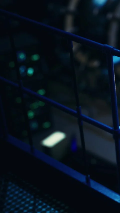 Computer equipment in a dark room with blue light and electric glow Stock Footage 336175916
