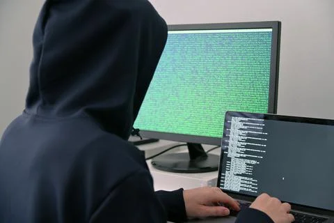 Computer expert hacker use technical knowledge to break into a computerized s 스톡 사진