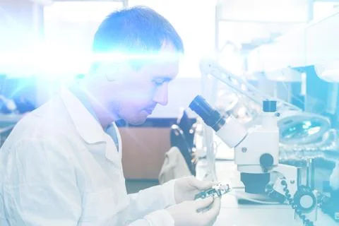 Computer expert professional technician examining board computer in a laboratory Foto stock