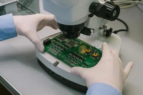 Computer expert professional technician examining board computer in a laboratory Foto stock