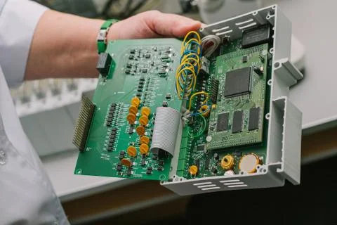 Computer expert professional technician examining board computer in a laboratory Foto stock