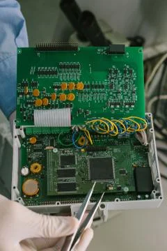 Computer expert professional technician examining board computer in a laboratory Foto stock