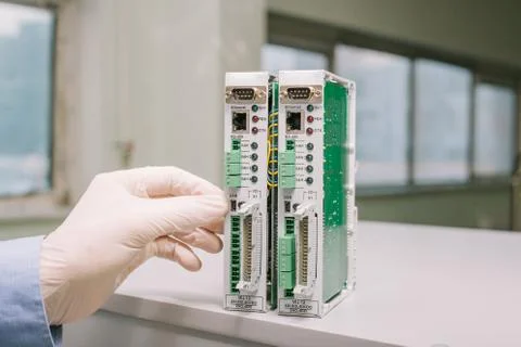 Computer expert professional technician examining board computer in a laboratory Foto stock