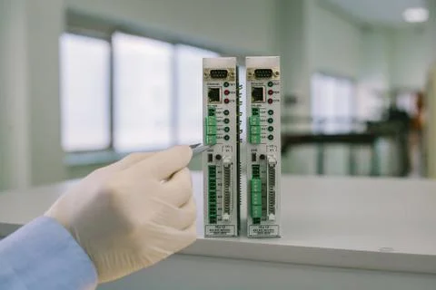 Computer expert professional technician examining board computer in a laboratory Stock Photos